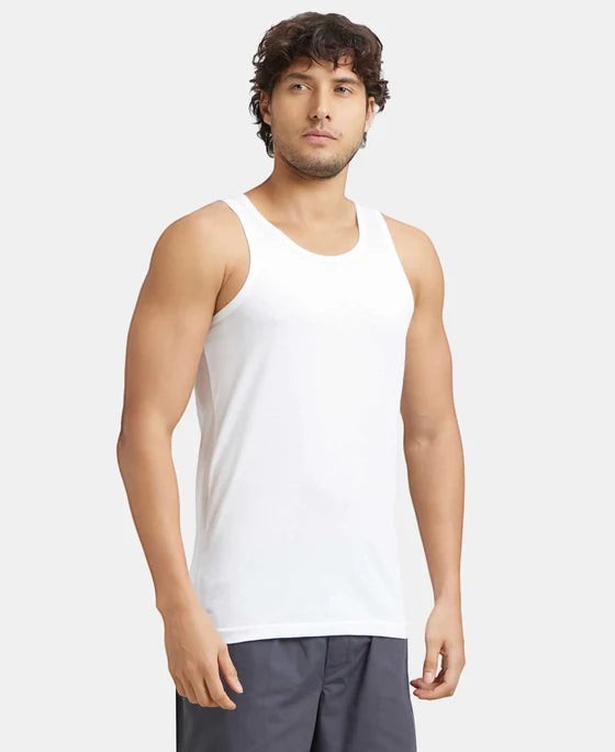 Ambika Stores white super combed cotton men's vest with extended length and round neck. Breathable and soft for everyday wear.