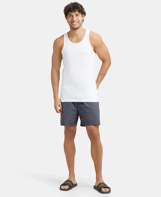 Ambika Stores white super combed cotton round neck men's vest with extended length for easy tuck.