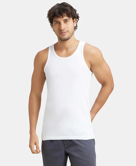 Ambika Stores white 100% super combed cotton men's round neck sleeveless vest with extended length for easy tuck.