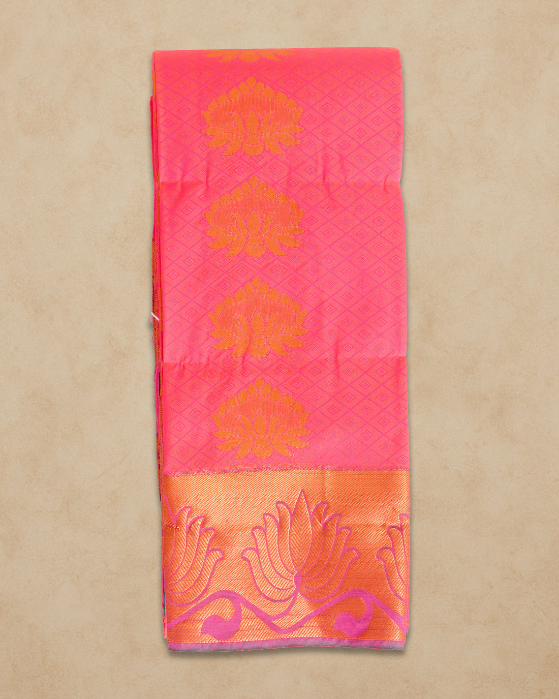 Ambika Stores pink silk saree with orange floral border and motifs, perfect for weddings and festivals.