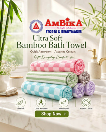 Ambika Stores ultra-soft bamboo bath towels in a stack of assorted pastel checkered colors on a marble bathroom counter