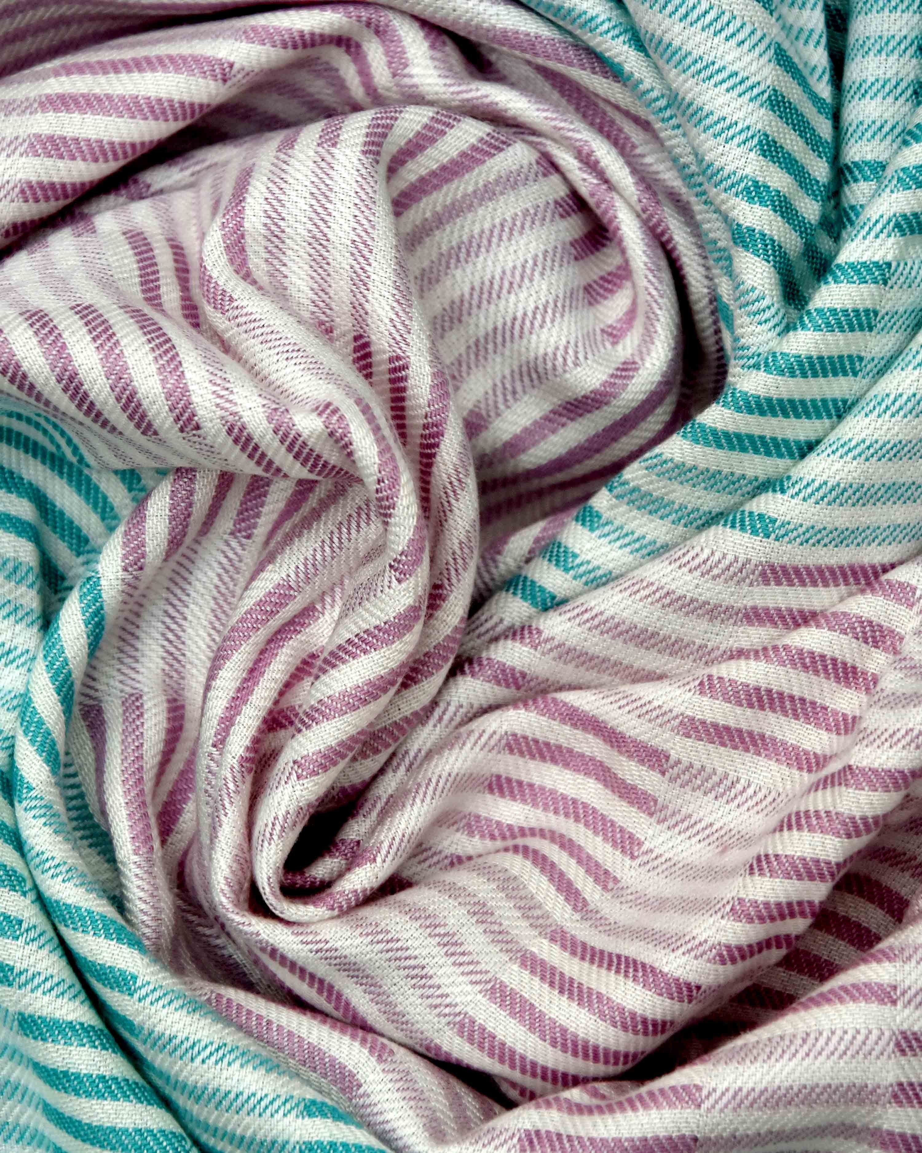 Ambika Stores bamboo bath towel with a soft, absorbent texture featuring a purple and teal striped pattern.