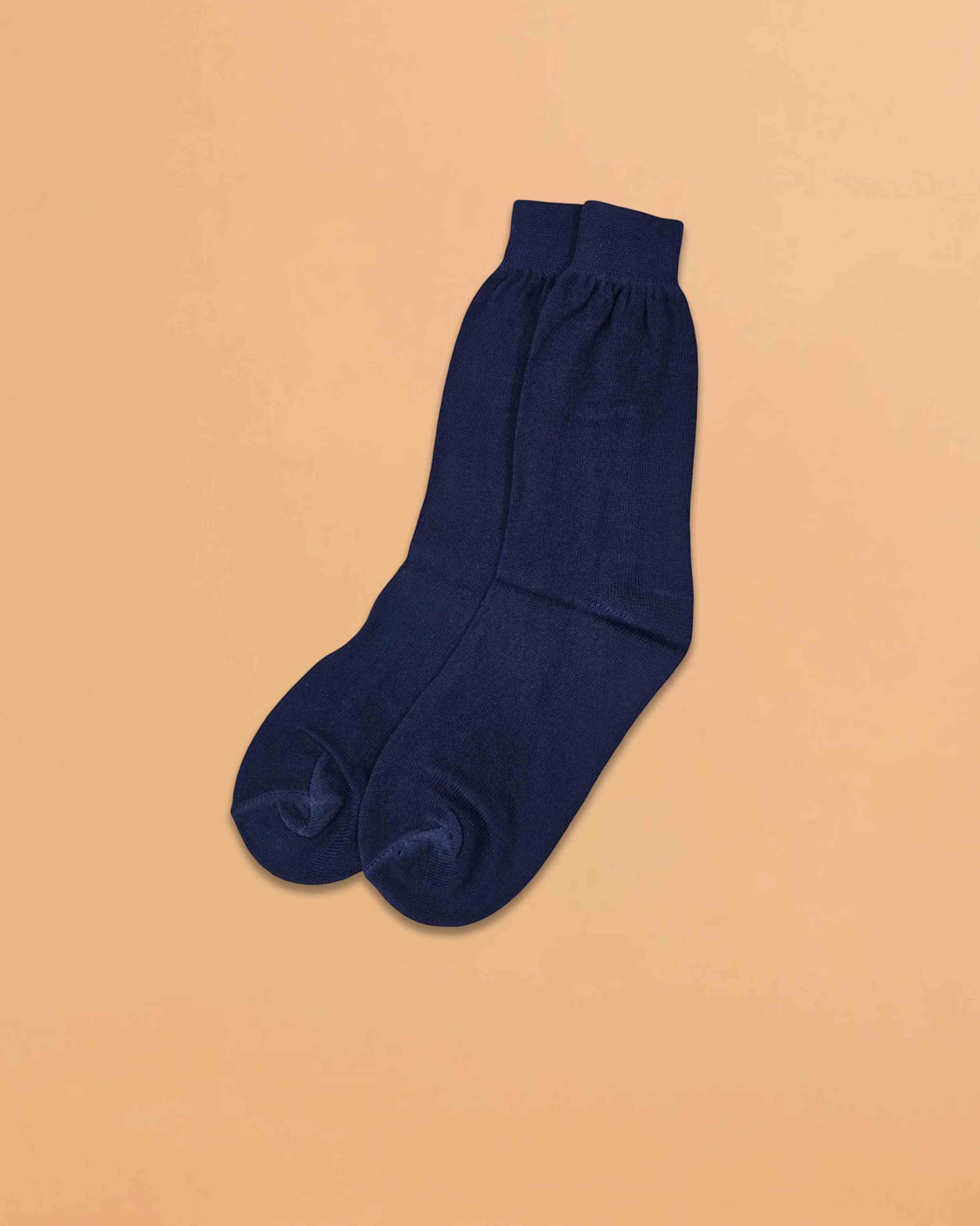 Ambika Stores plain black organic combed cotton school socks for boys and girls in a full-length design