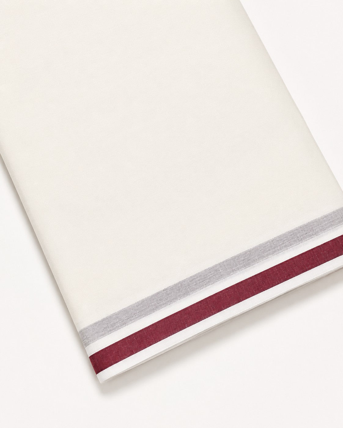 Ambika Stores unbleached off-white cotton dhoti with a maroon and grey border for traditional temple wear