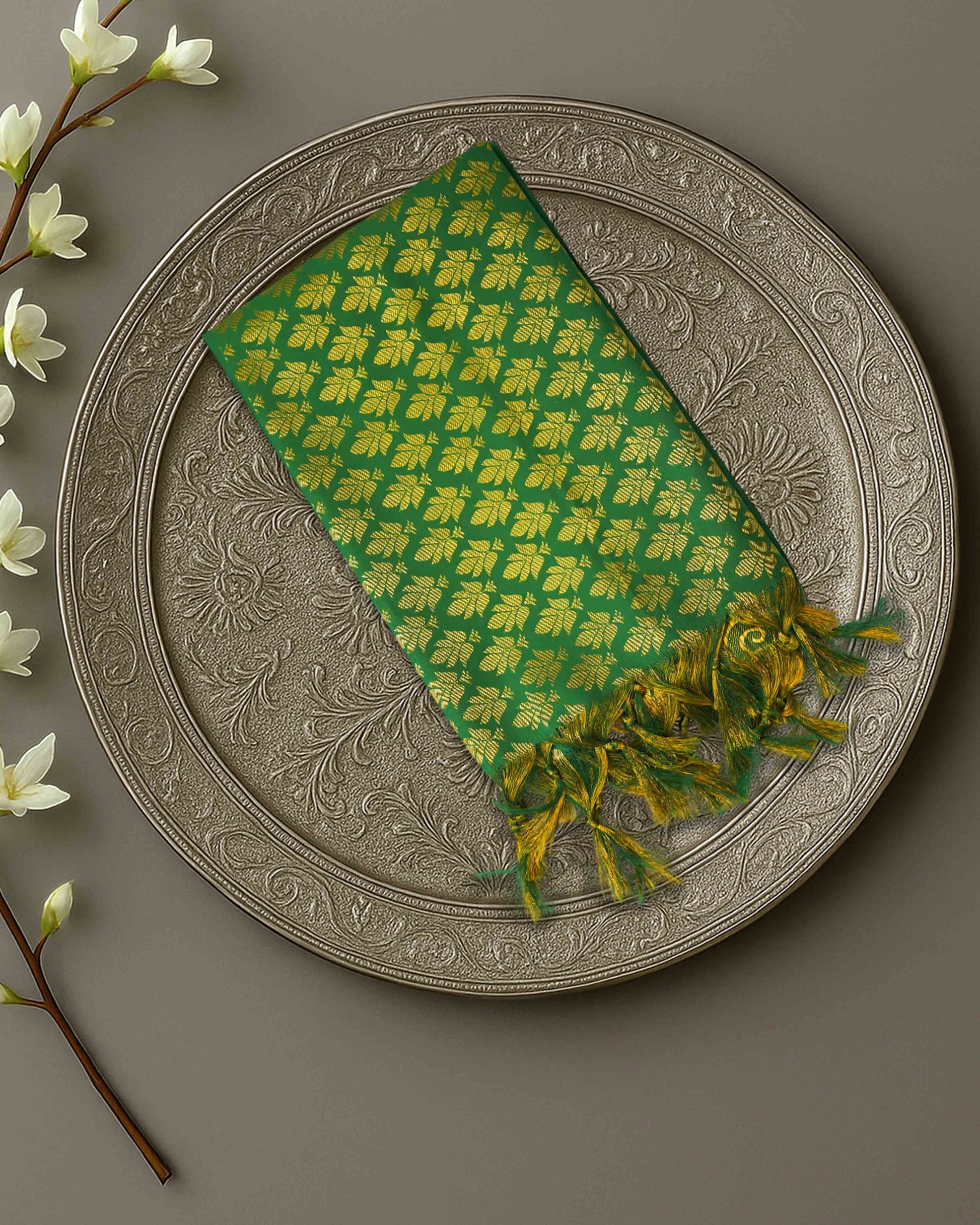Ambika Stores green and gold zari Ponnadai shawl with traditional woven patterns and decorative tassels