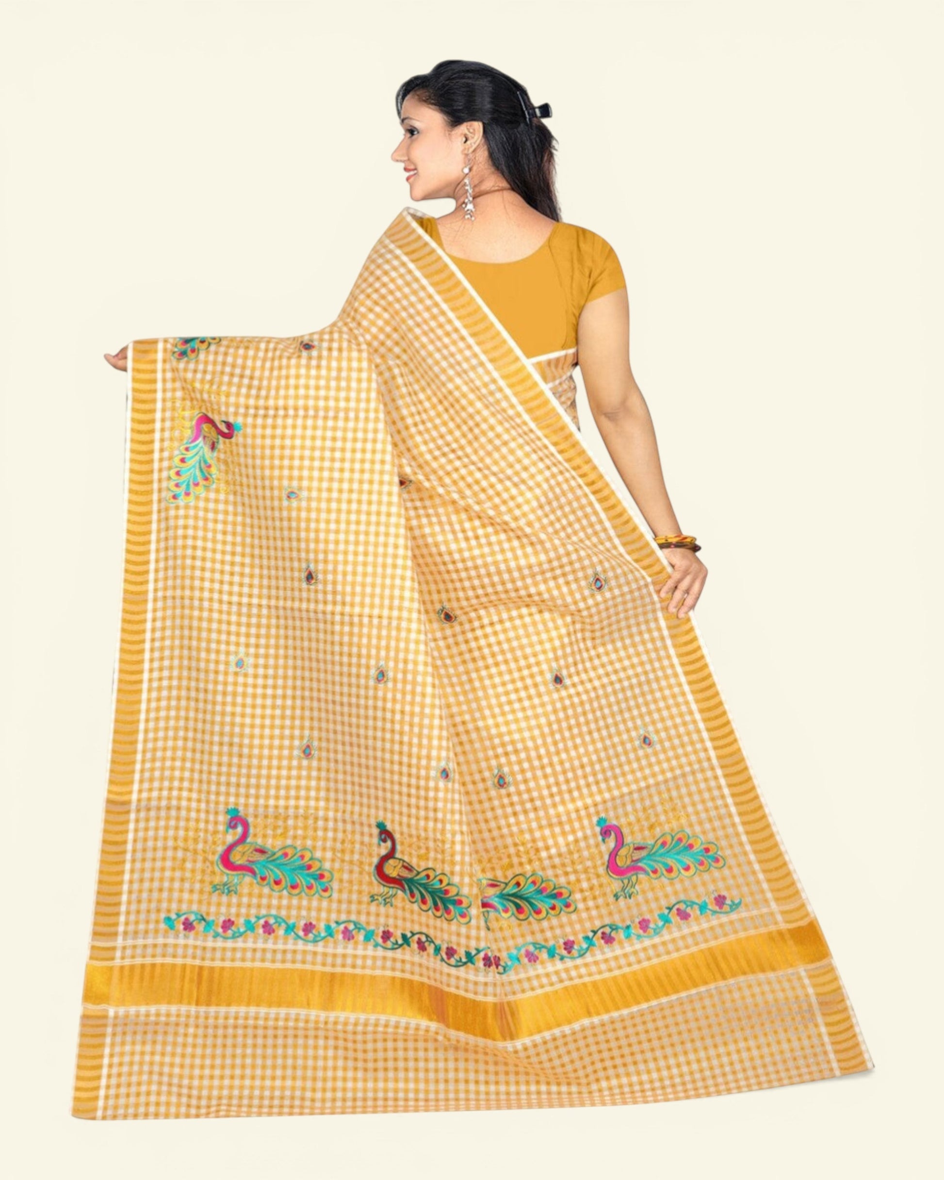 Ambika Stores women's off-white cotton Kerala saree with gold zari checked pattern and peacock embroidery. Includes running blouse.