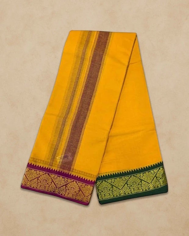 Ambika Stores mango yellow cotton panjakacham dhoti set with traditional purple and green zari borders