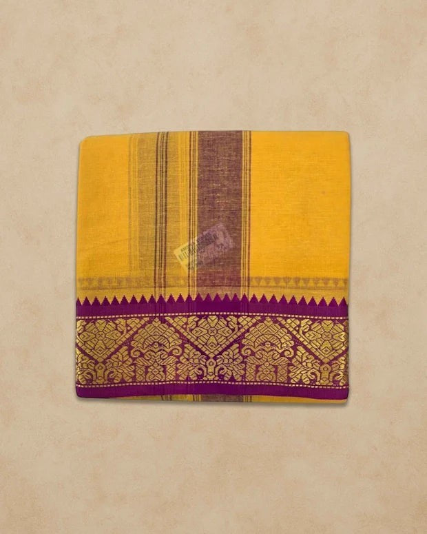 Ambika Stores mango yellow cotton panjakacham dhoti set with a purple and gold zari border and matching angavastram.