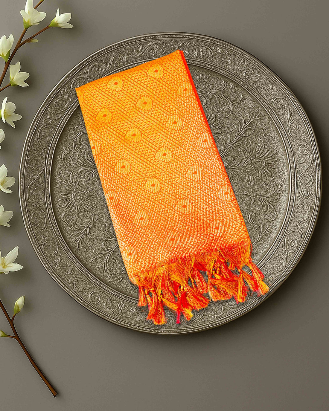 Ambika Stores premium Ponnadai Jari shawls in vibrant colours with intricate gold patterns and decorative tassels.