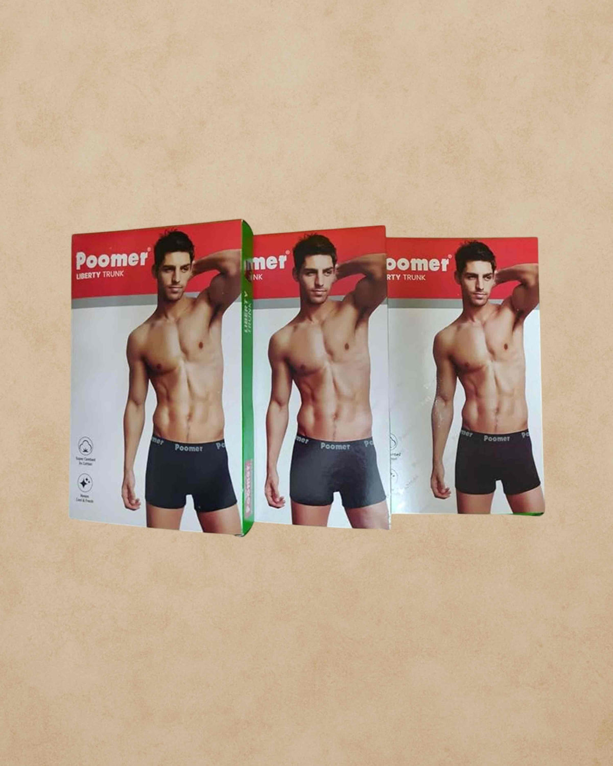 Ambika Stores Poomer Liberty cotton trunks in black with branded elastic waistband, shown in three product boxes.