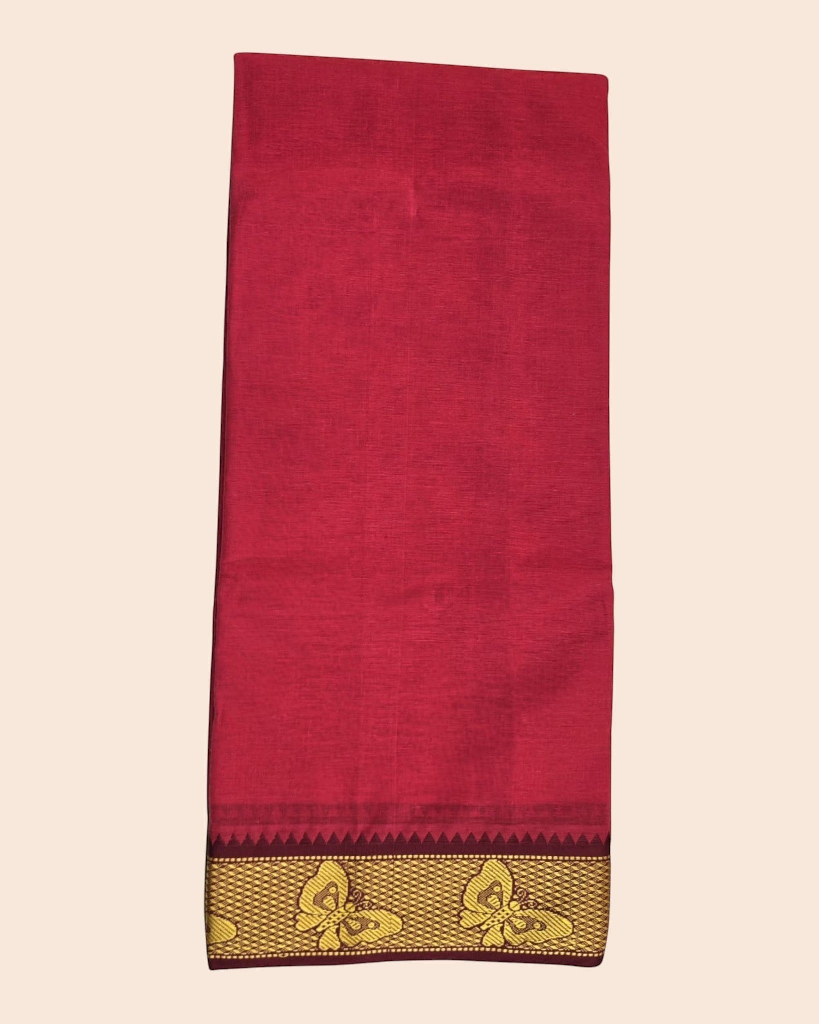 Ambika Stores red cotton Panjakacham dhoti with a gold zari border featuring traditional butterfly motifs