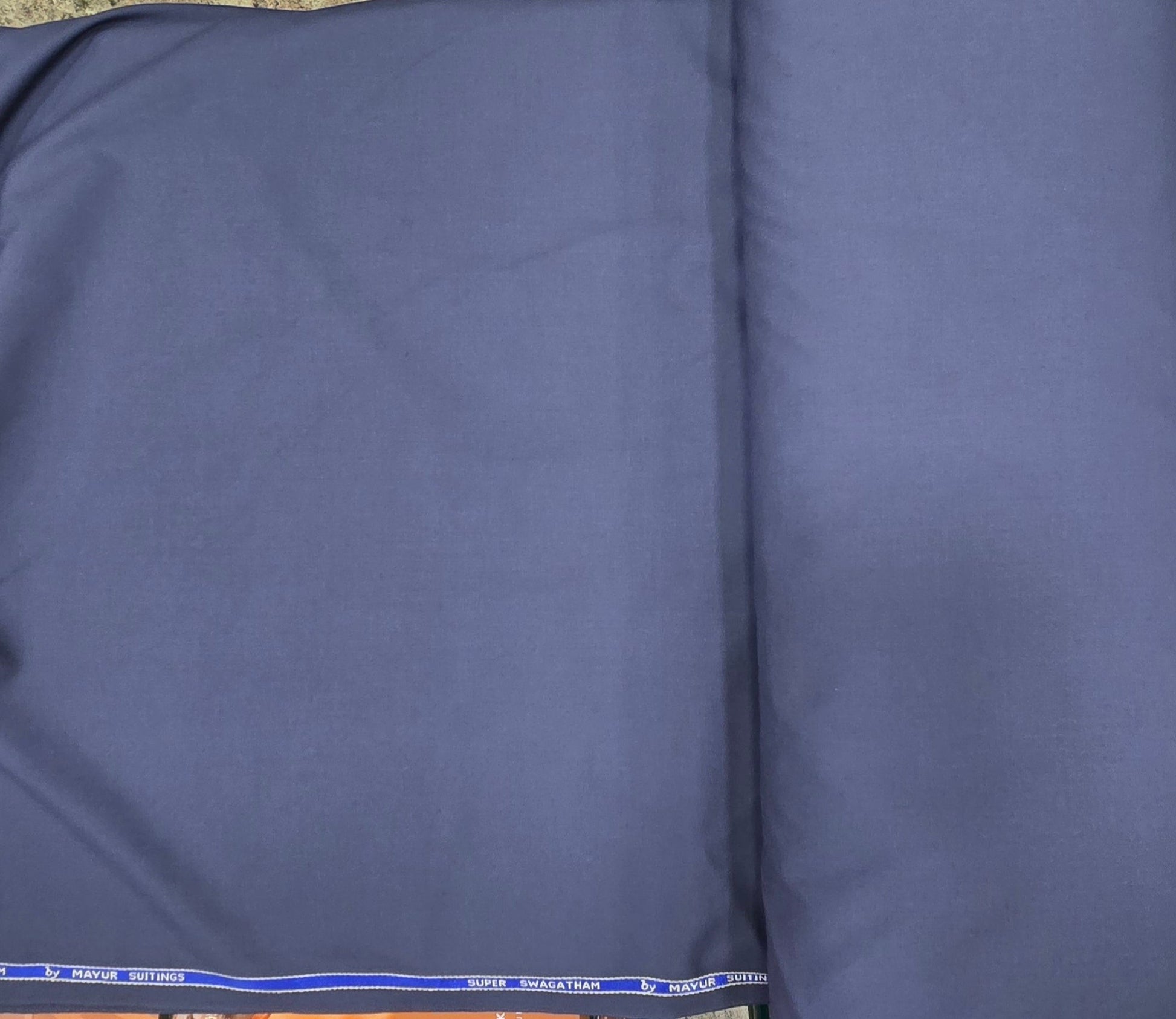 Ambika Stores dark grey uniform suiting fabric for Velammal Vidyalaya Nexus, featuring a durable, wrinkle-resistant weave.