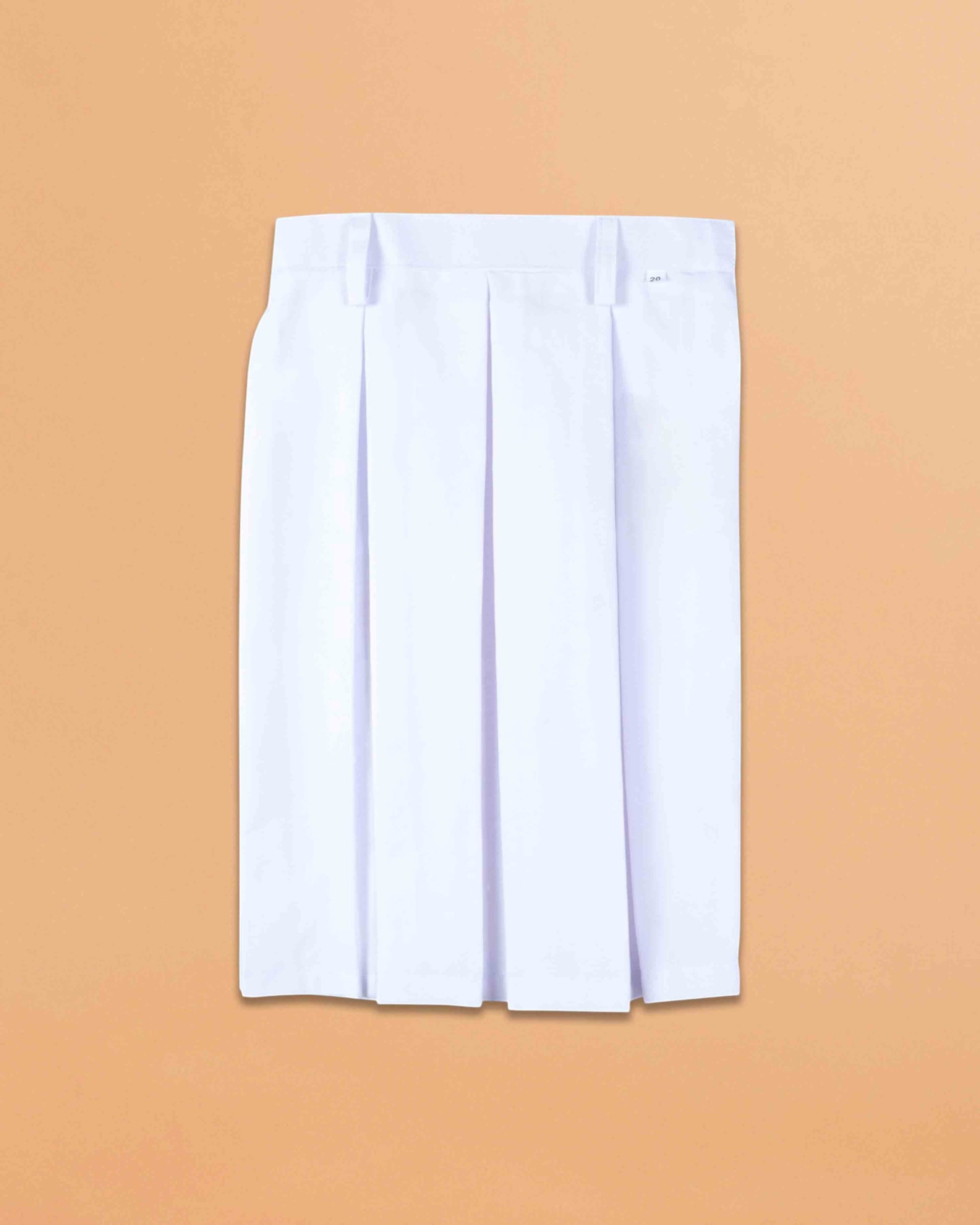 Ambika Stores white girls school uniform skirt in durable terrycot fabric with a one-side pleated design.