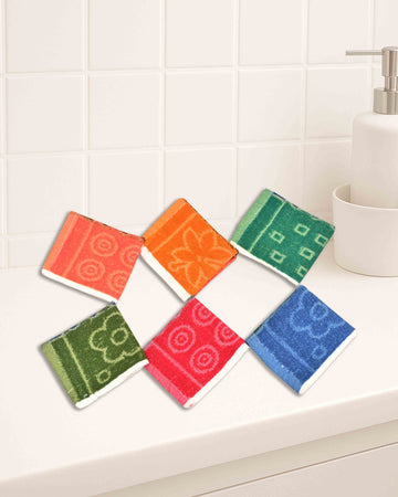 Ambika Stores cotton hand towel set featuring six colorful 10x10 inch washcloths with floral and geometric patterns.