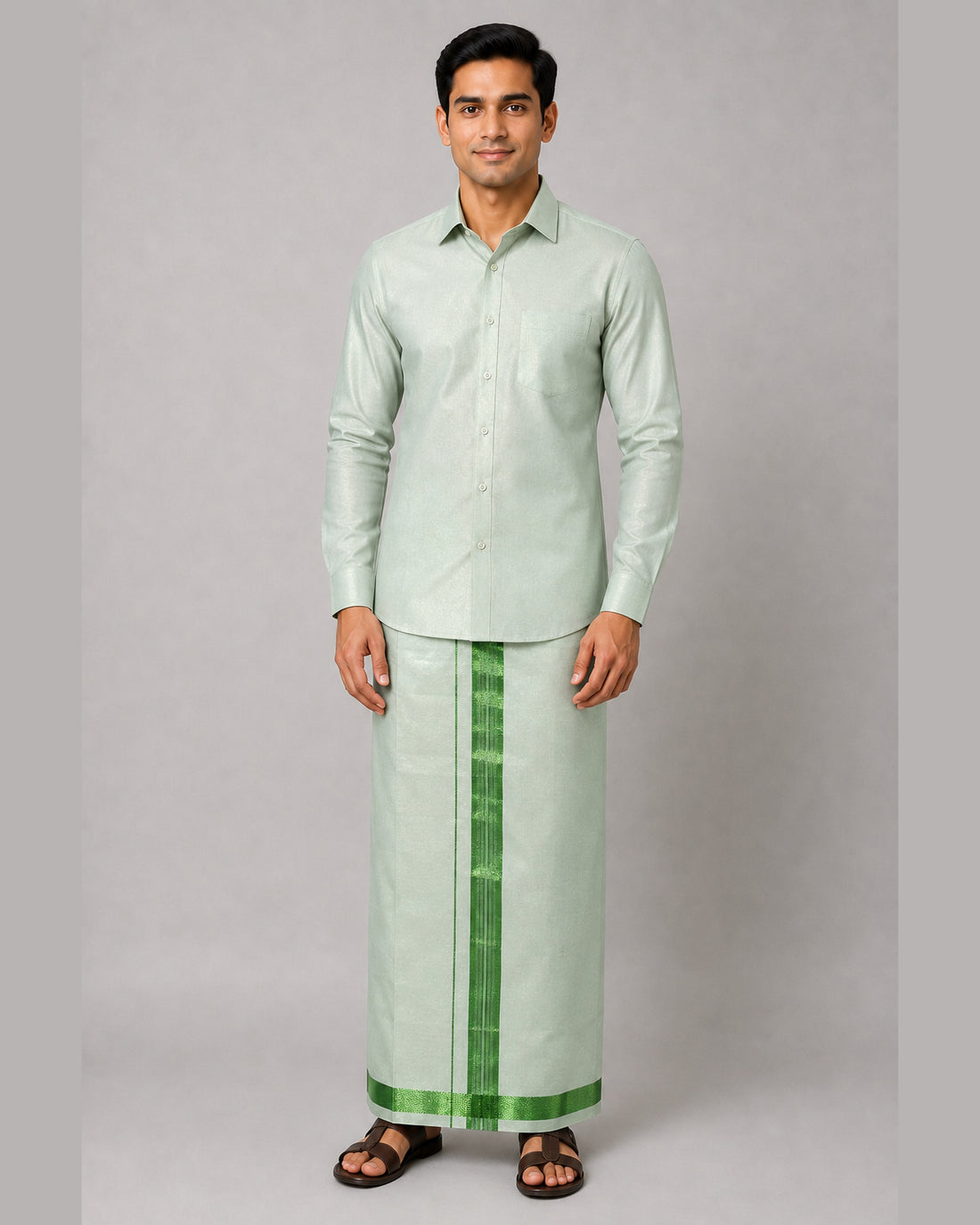 Men’s mint green tissue shirt and single dhoti set with emerald green jari border, model view 1 – Ambika Stores