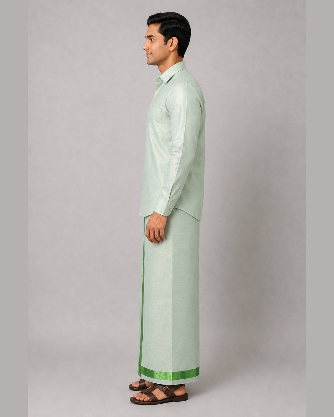 Men’s mint green tissue shirt and single dhoti set with emerald green jari border, model view 1 – Ambika Stores