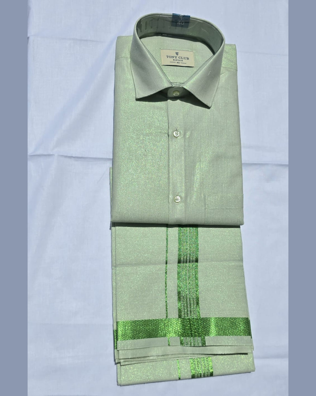 Men’s mint green tissue shirt and single dhoti set with emerald green jari border, folded product – Ambika Stores