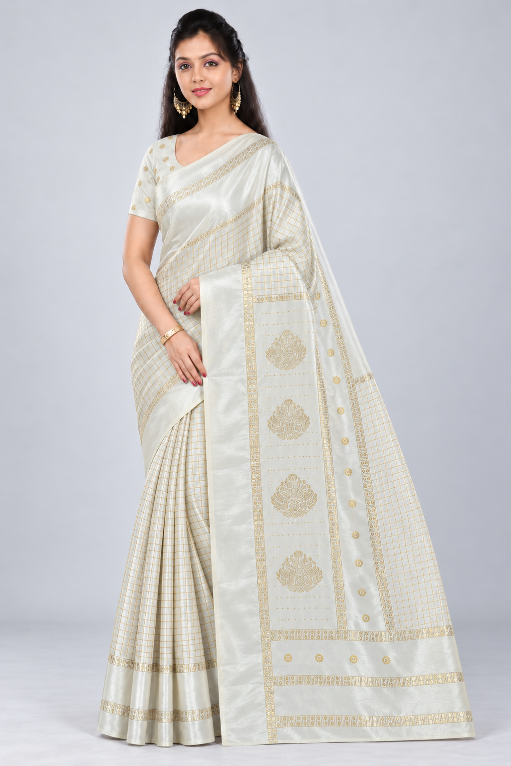 Three-quarter view of PARIS BEAUTY ivory saree showing gold-tone checks, front pleats and ornamental pallu.