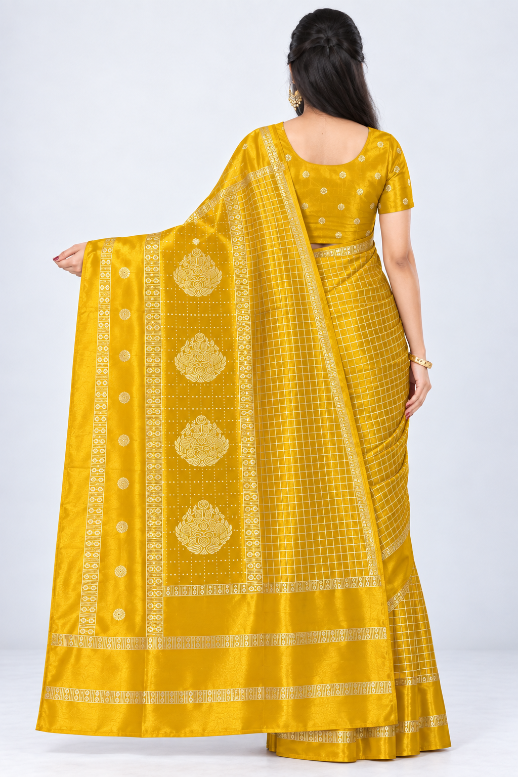 Back view of PARIS BEAUTY mustard yellow Turkey Silk saree with gold-tone checks, decorative border and ornamental pallu.