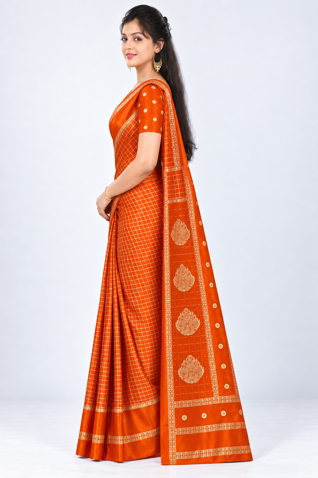 Side view of PARIS BEAUTY orange Turkey Silk saree with gold-tone checks, decorative border and ornamental pallu.