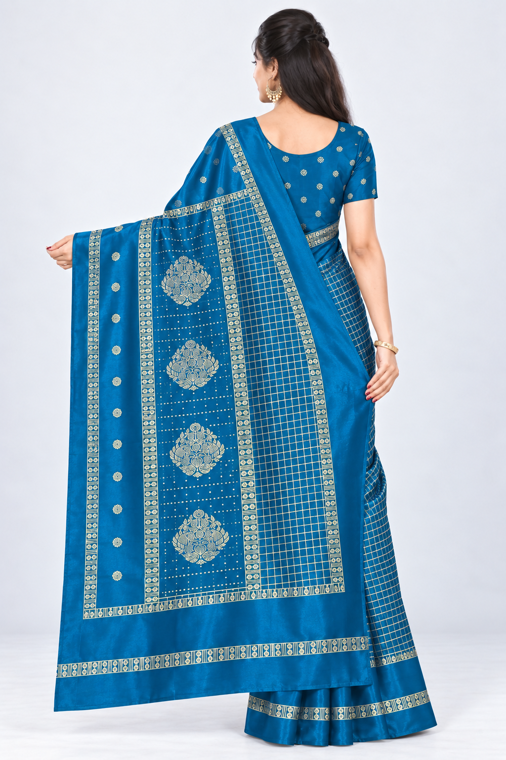 Back view of PARIS BEAUTY peacock blue Turkey Silk saree with gold-tone checks, decorative border and ornamental pallu.