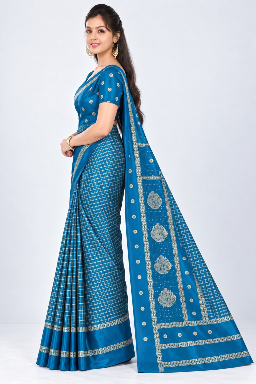 Side view of PARIS BEAUTY peacock blue Turkey Silk saree with gold-tone checks, decorative border and ornamental pallu.
