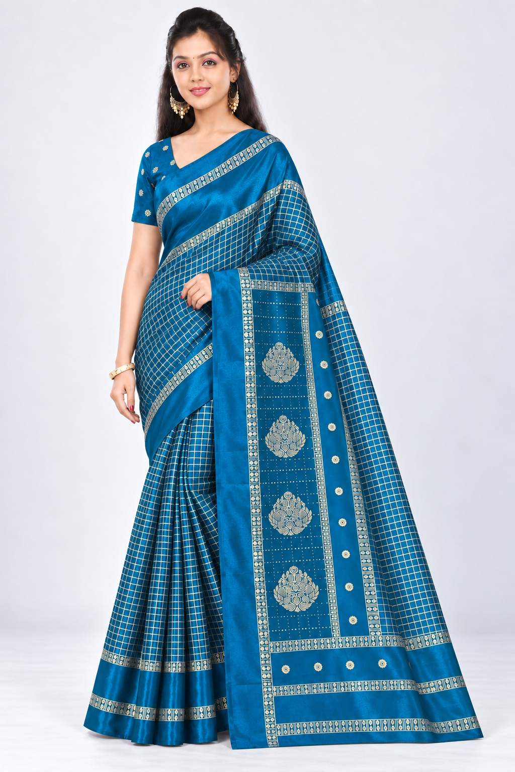 Three-quarter view of PARIS BEAUTY peacock blue Turkey Silk saree with gold-tone checks, decorative border and ornamental pallu.