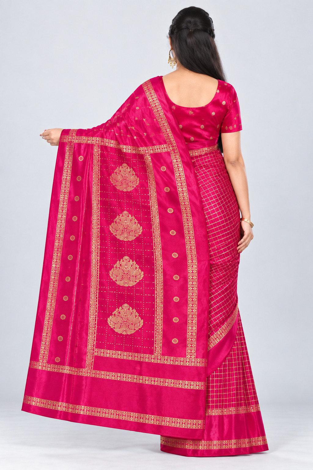 Back view of PARIS BEAUTY rani pink Turkey Silk saree with gold-tone checks, decorative border and ornamental pallu.