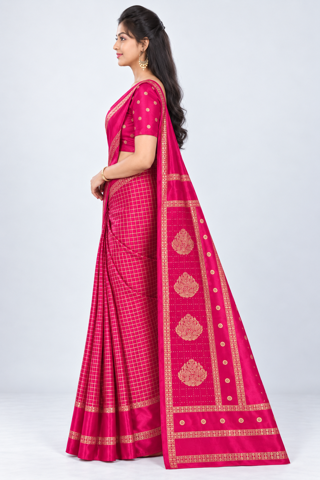 Side view of PARIS BEAUTY rani pink Turkey Silk saree with gold-tone checks, decorative border and ornamental pallu.