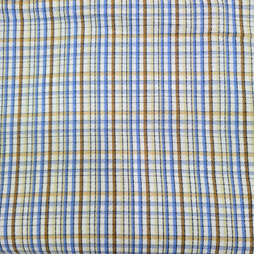 Close-up of plaid fabric with blue, brown, and beige colors.
