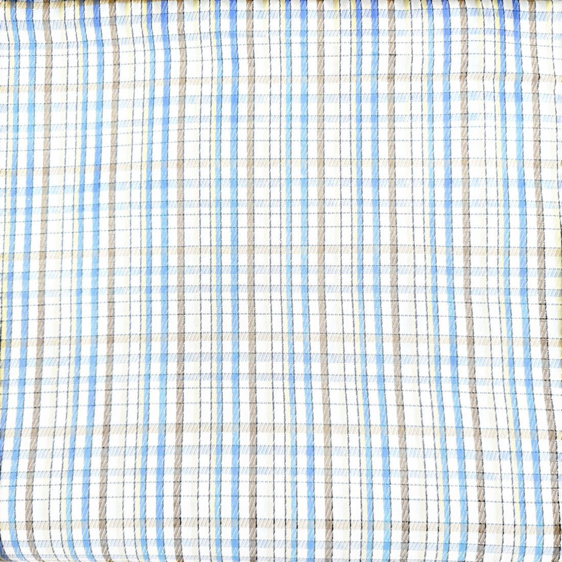 Close-up of plaid fabric with blue, brown, and beige colors.